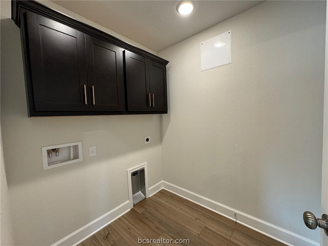 clothes washing area with hookup for an electric dryer, dark hardwood / wood-style floors, cabinets, and hookup for a washing machine