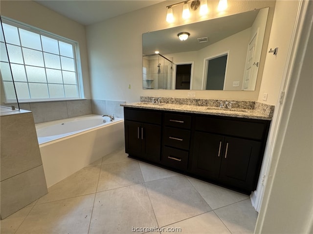 bathroom with tile patterned flooring, vanity, and independent shower and bath