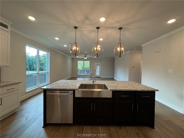 kitchen featuring white cabinetry, stainless steel dishwasher, a healthy amount of sunlight, and sink