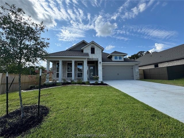 view of front of house featuring a front lawn and a garage