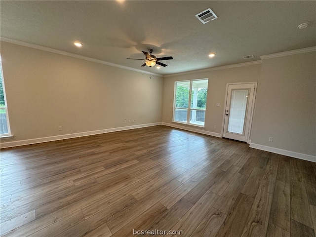 unfurnished room with a textured ceiling, crown molding, ceiling fan, and dark wood-type flooring