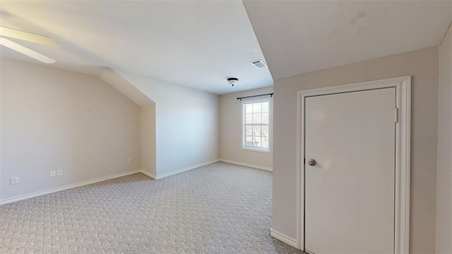 bonus room with a ceiling fan, visible vents, light carpet, and baseboards