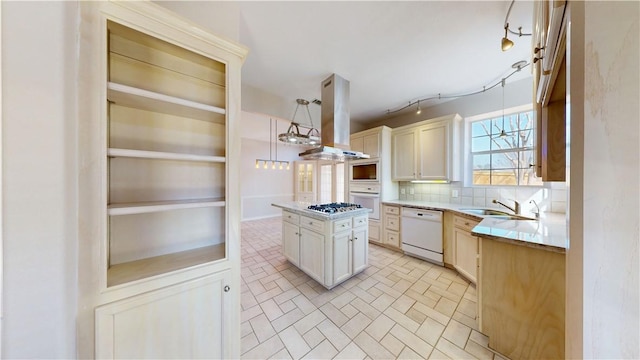 kitchen featuring island range hood, white appliances, a sink, a kitchen island, and tasteful backsplash