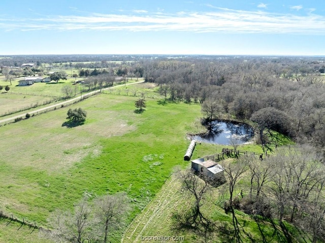 aerial view featuring a rural view and a water view