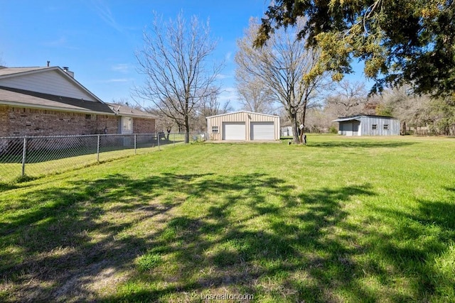 view of yard with an outbuilding and a garage