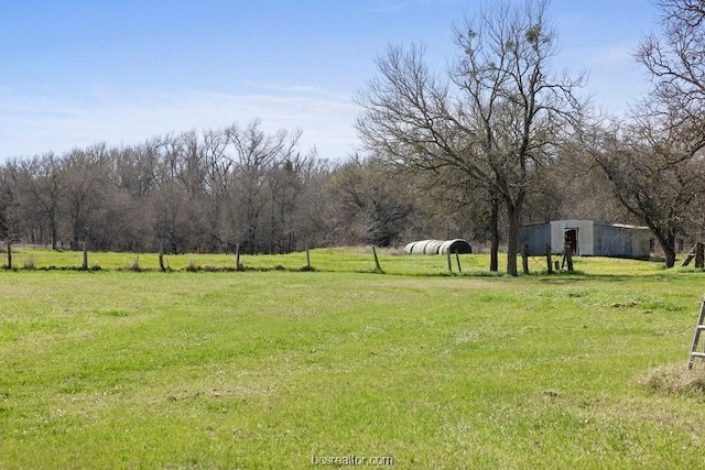 view of yard with a rural view