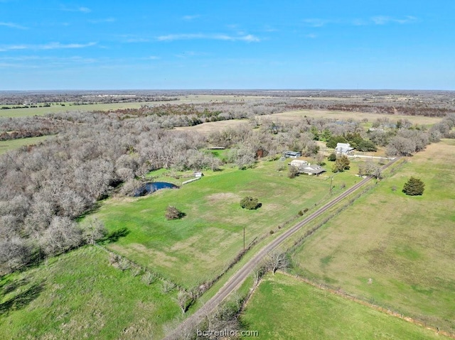 birds eye view of property featuring a rural view