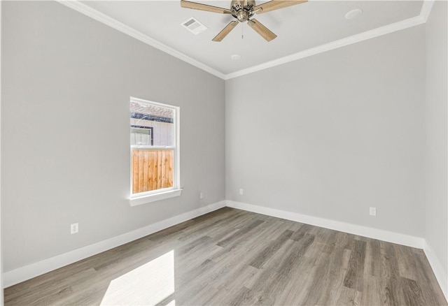 empty room featuring ceiling fan, light hardwood / wood-style flooring, and ornamental molding