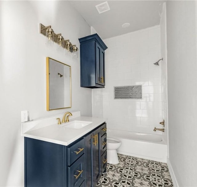 full bathroom with tile patterned flooring, vanity, toilet, and tiled shower / bath