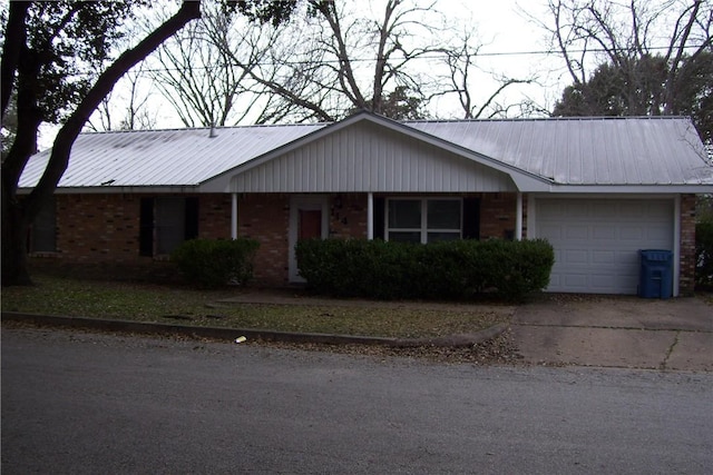 ranch-style house featuring a garage