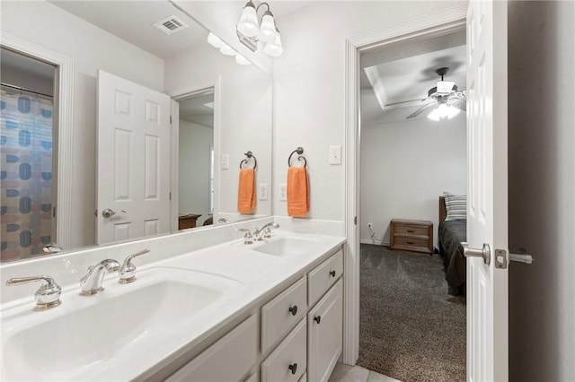 full bath featuring visible vents, a sink, ceiling fan, and double vanity