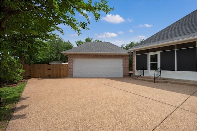 detached garage featuring a gate