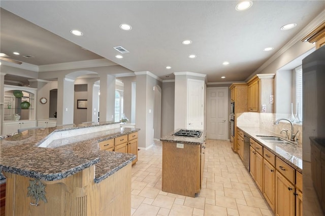 kitchen featuring a sink, a center island, recessed lighting, visible vents, and ornamental molding