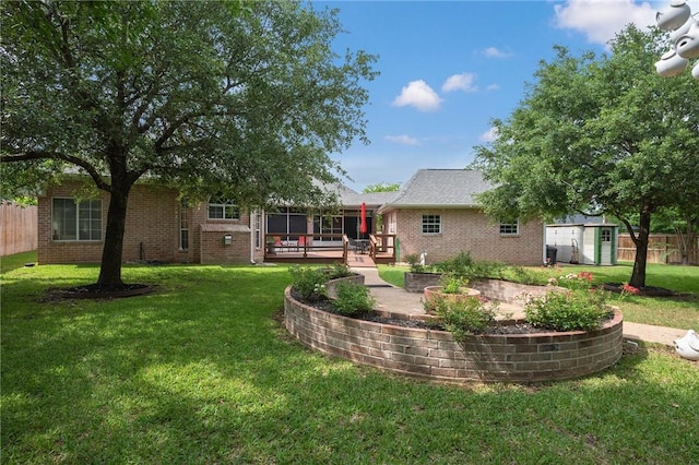 rear view of house featuring brick siding, an outdoor structure, a lawn, and a storage shed