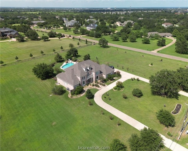 birds eye view of property with a rural view