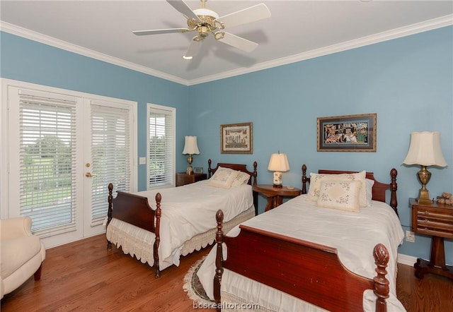 bedroom featuring ceiling fan, ornamental molding, access to outside, and multiple windows