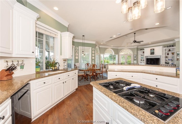 kitchen with black gas cooktop, white cabinets, decorative light fixtures, and ceiling fan