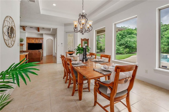 3281 Toltec Trl, College Station, TX 77845 - dining room featuring a tray ceiling, a chandelier, and a wealth of natural light