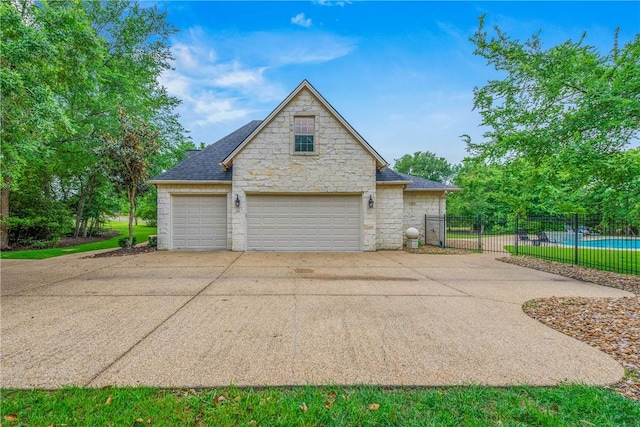 3281 Toltec Trl, College Station, TX 77845 - garage featuring fence and concrete driveway