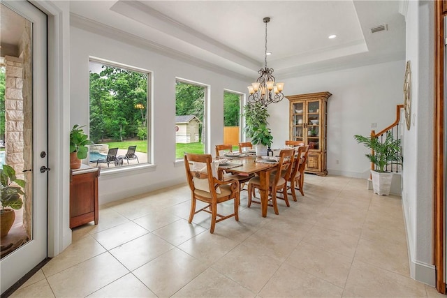 3281 Toltec Trl, College Station, TX 77845 - dining area with visible vents, a notable chandelier, light tile patterned flooring, and a tray ceiling