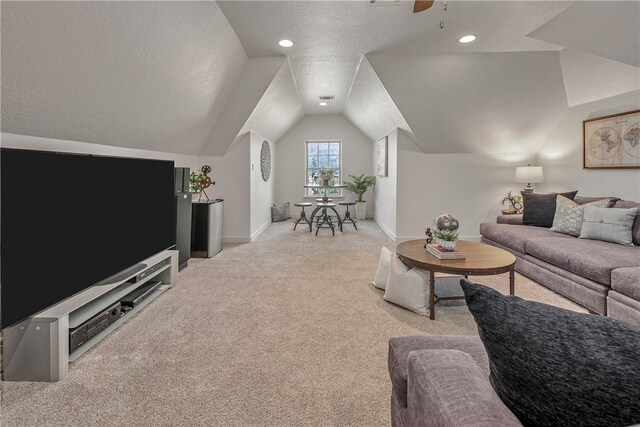 3281 Toltec Trl, College Station, TX 77845 - living room featuring carpet floors, a textured ceiling, a ceiling fan, baseboards, and lofted ceiling