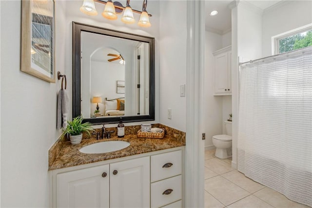 3281 Toltec Trl, College Station, TX 77845 - bathroom featuring crown molding, vanity, tile patterned flooring, and toilet