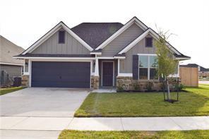 3429 Alsace Ct, Bryan, TX 77808 - craftsman inspired home with concrete driveway, a front yard, a garage, and stone siding
