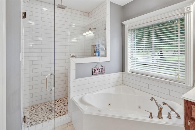 4886 Burt Rd, Bryan, TX 77807 - bathroom with a shower stall, a whirlpool tub, and vanity