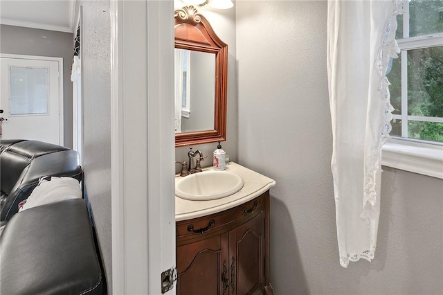 4886 Burt Rd, Bryan, TX 77807 - bathroom with vanity and crown molding