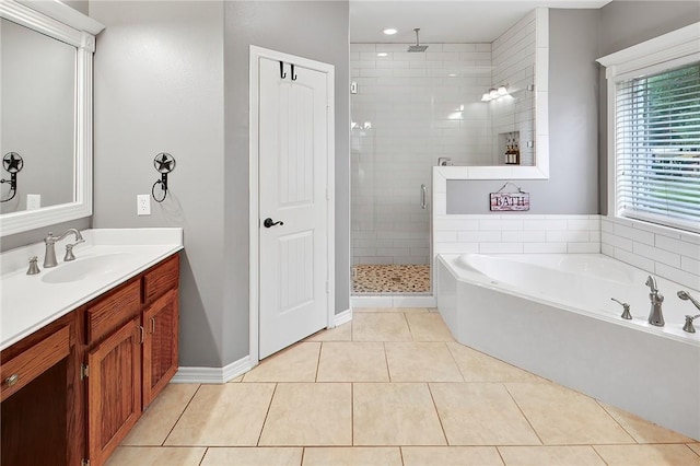4886 Burt Rd, Bryan, TX 77807 - bathroom featuring a stall shower, a garden tub, vanity, and tile patterned floors