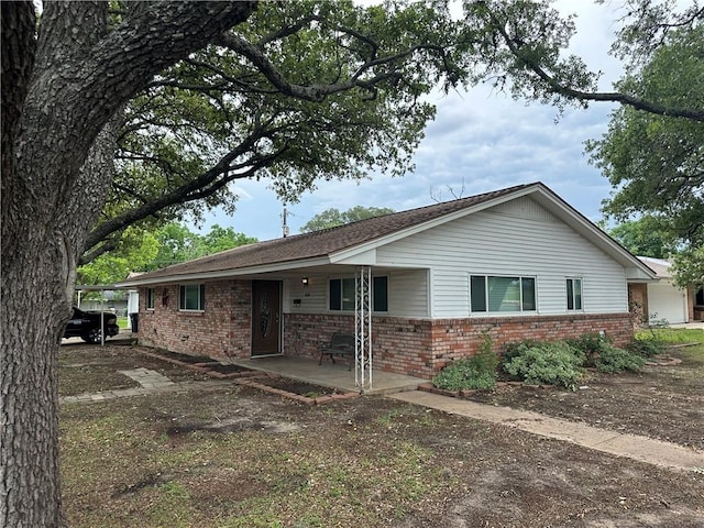 1620 George Bush Dr, College Station, TX 77840 - single story home with brick siding and covered porch