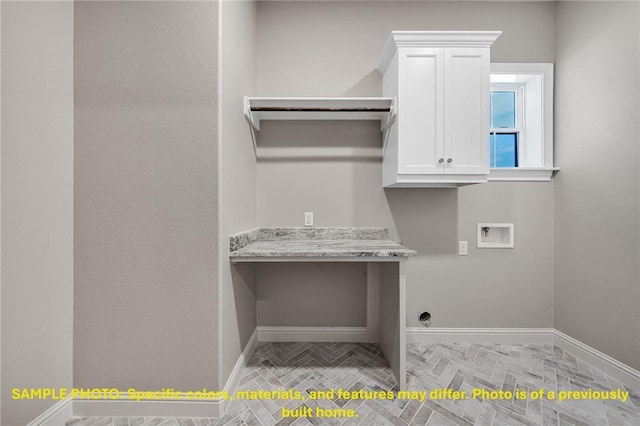 4760 Coral River Rd, College Station, TX 77845 - laundry room featuring baseboards, washer hookup, and cabinet space