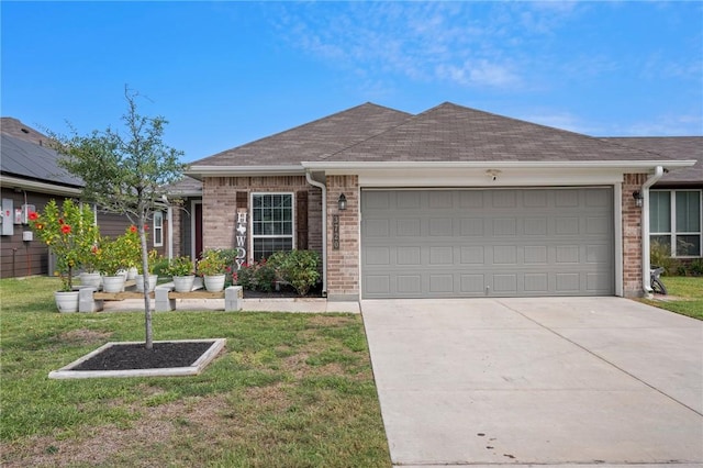 ranch-style home featuring a garage and a front lawn