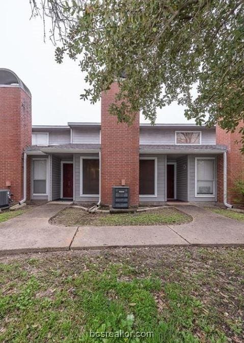 front facade featuring central AC unit