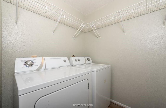 washroom featuring independent washer and dryer