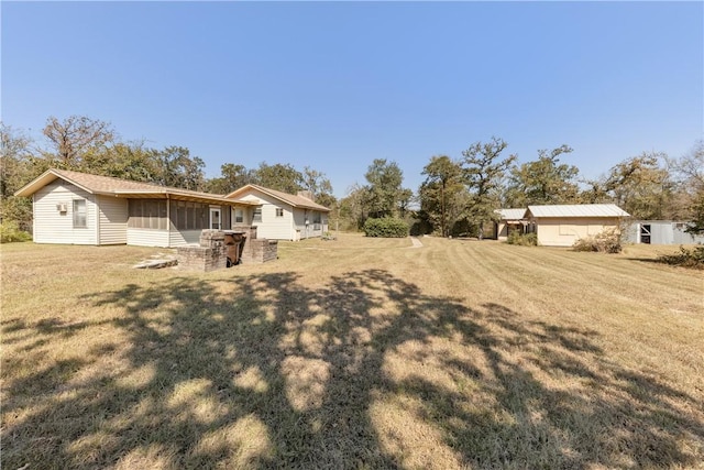 view of yard with a sunroom