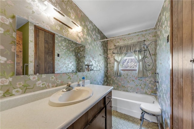 bathroom with wood walls, tile patterned flooring, vanity, and shower / bath combination