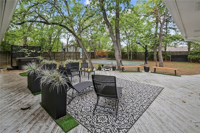 deck featuring a hot tub