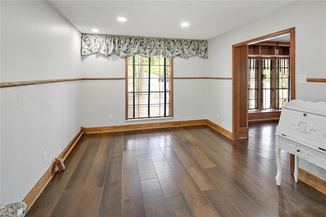 unfurnished dining area featuring dark hardwood / wood-style flooring