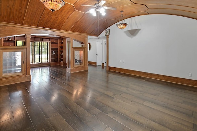 interior space with dark hardwood / wood-style floors, ornate columns, ceiling fan, and lofted ceiling