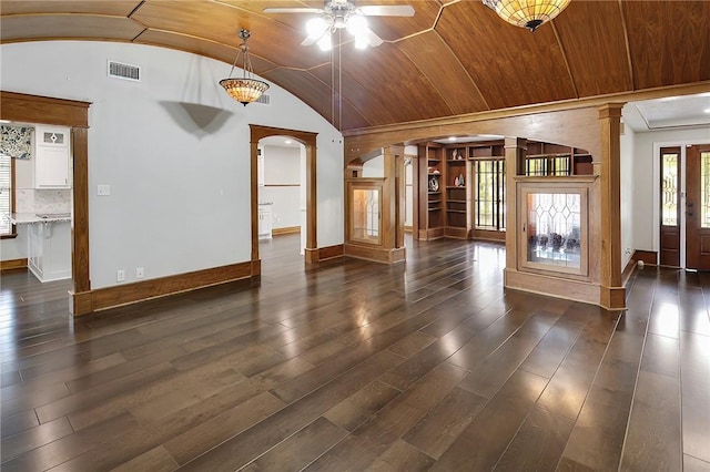 unfurnished living room with ceiling fan, wooden ceiling, dark hardwood / wood-style flooring, decorative columns, and vaulted ceiling