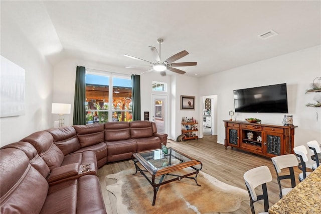 7902 Putter Place Ct, Navasota, TX 77868 - living area with a ceiling fan and light wood-style floors