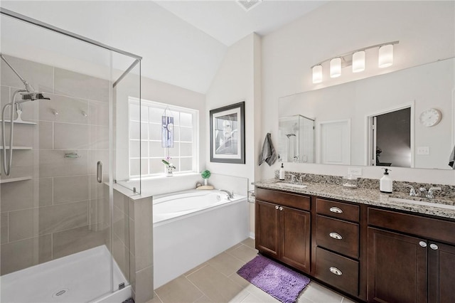 7902 Putter Place Ct, Navasota, TX 77868 - full bath with a stall shower, a garden tub, double vanity, lofted ceiling, and tile patterned floors