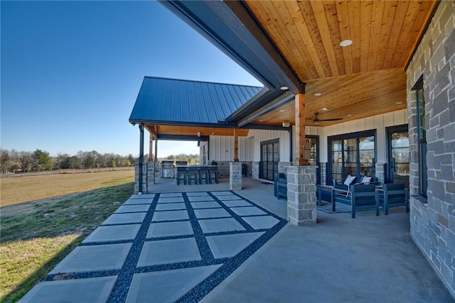 view of patio featuring an outdoor hangout area and ceiling fan