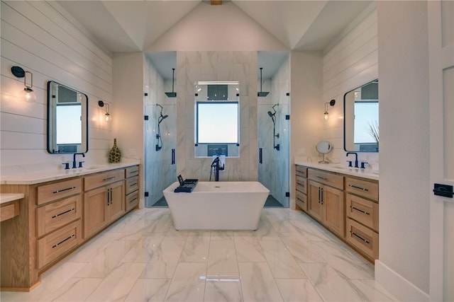 bathroom with vanity, vaulted ceiling, and plus walk in shower