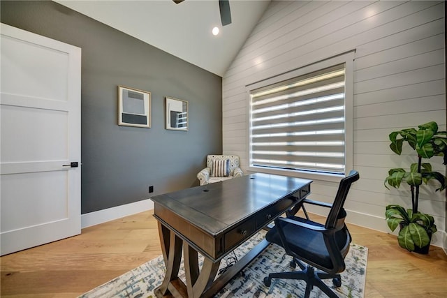 office area with vaulted ceiling, ceiling fan, and light hardwood / wood-style floors