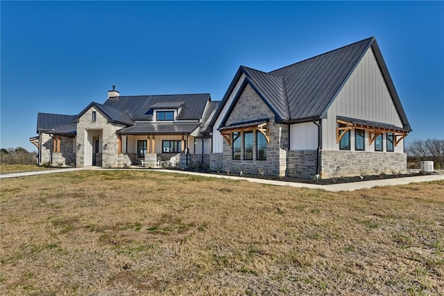 view of front facade featuring central AC, covered porch, and a front lawn