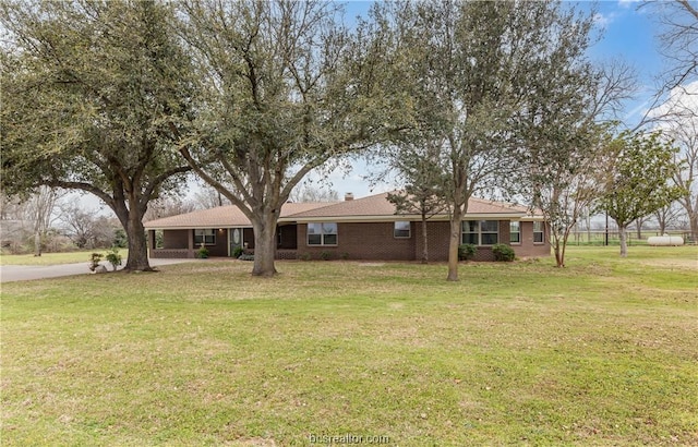 ranch-style house with a front lawn