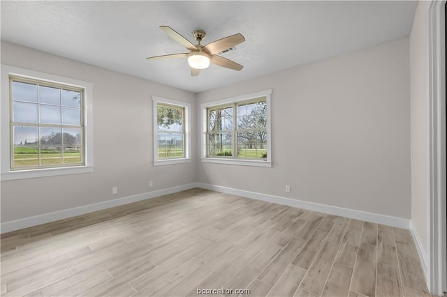 unfurnished room featuring ceiling fan and light hardwood / wood-style flooring