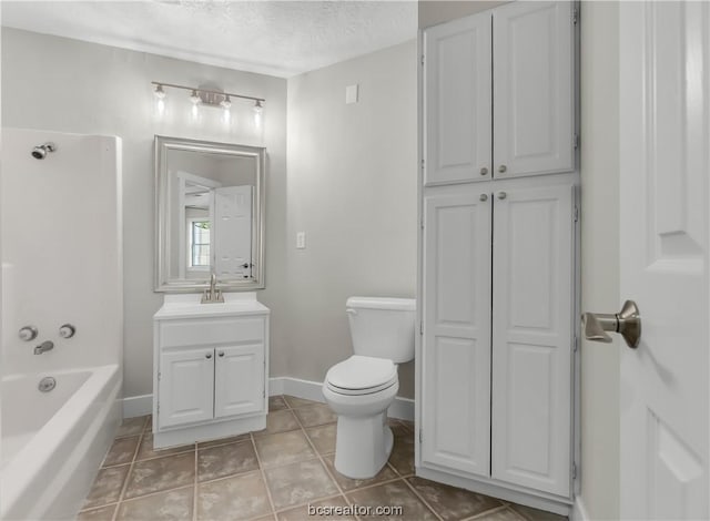 full bathroom featuring tile patterned floors,  shower combination, a textured ceiling, toilet, and vanity